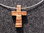 Kreuz aus Zebrano mit Metallband